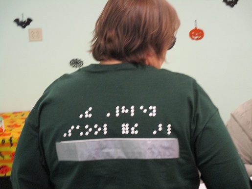 This T-shirt says The Hadley School of the Blind in Braille.